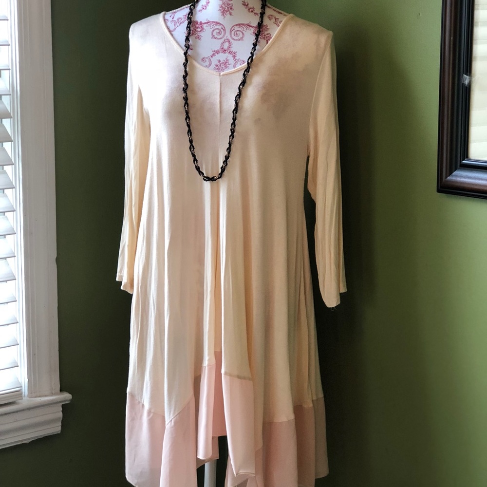Light peach, silky hemmed tunic.